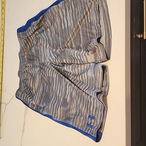 Boys Under Armour athletic shorts with blue stripe down legs